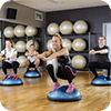 image of people working out on bosu equipment.